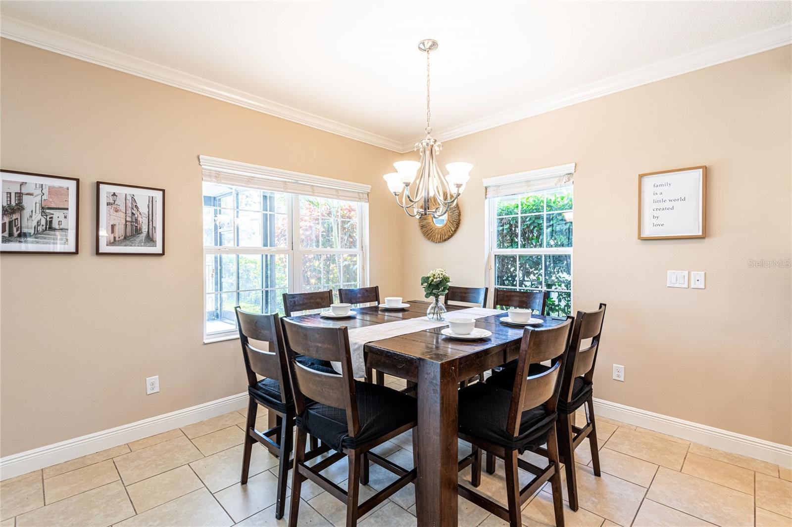 The gourmet kitchen features a separate eating area with the view of the lanai
