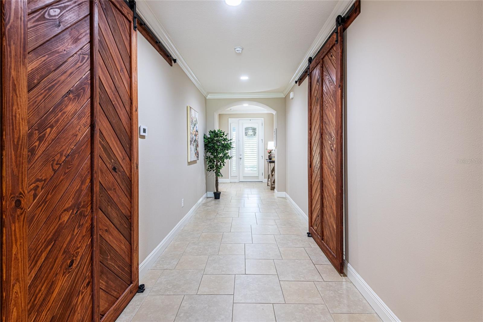 Matching barn doors were added to separate the upstairs area and add more privacy to the bedroom #4.