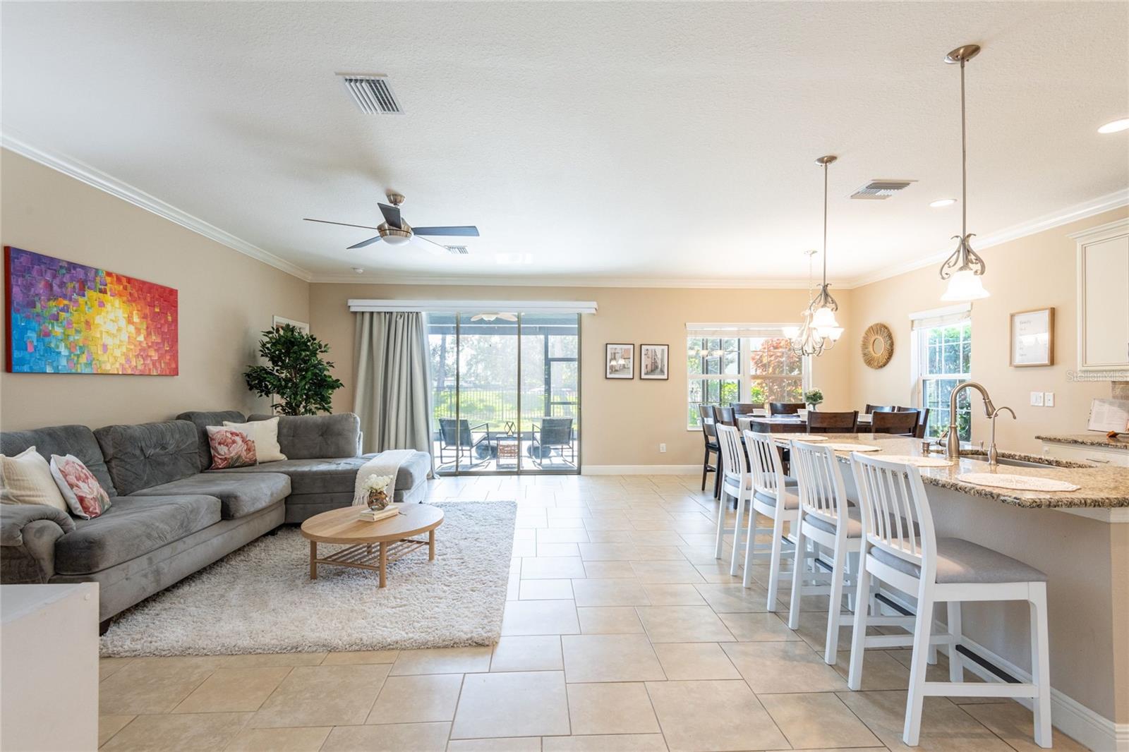 As you enter through the front door, you are welcomed into an expansive, open Family & Dining room.