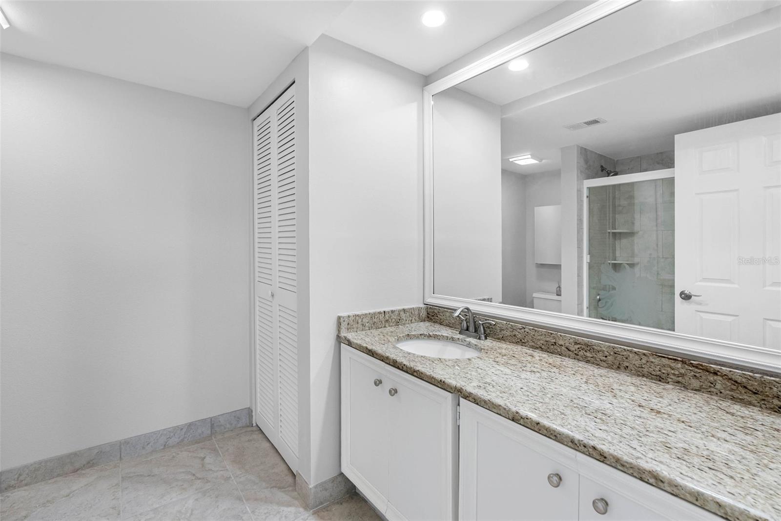 Primary Bath with tub/shower and large linen closet