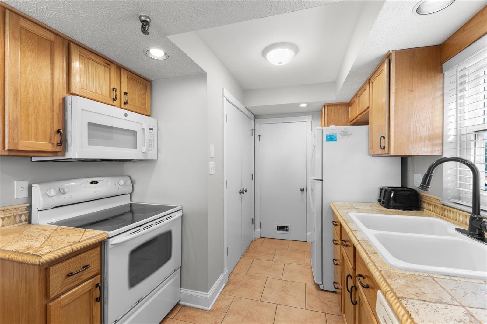 Extra-large owners closet located at the kitchens end.