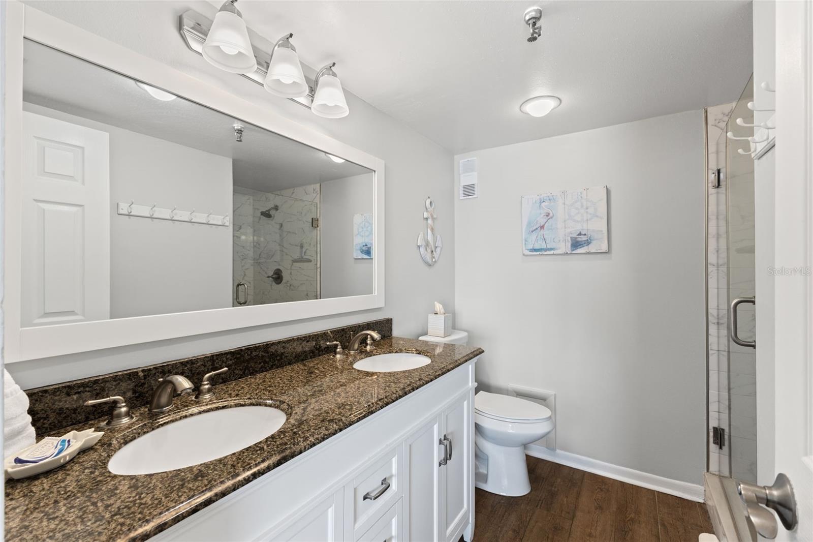 Primary Bathroom with a walk-in remodeled shower