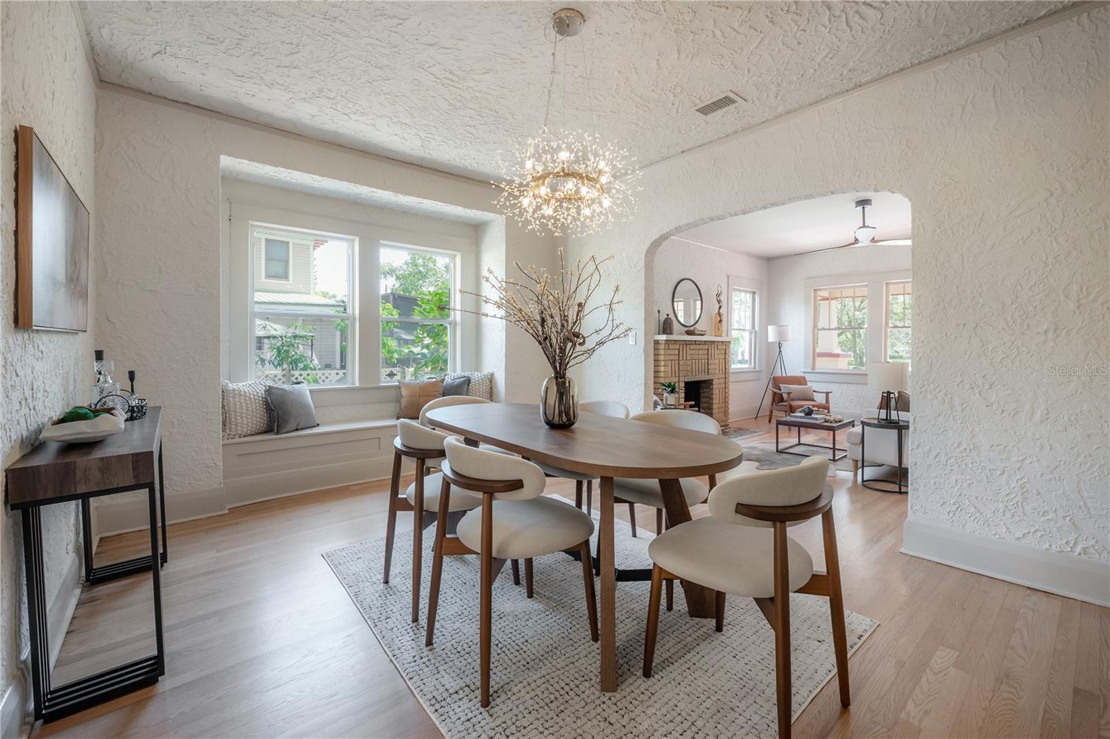 Bright Dining Area With Designer Lighting