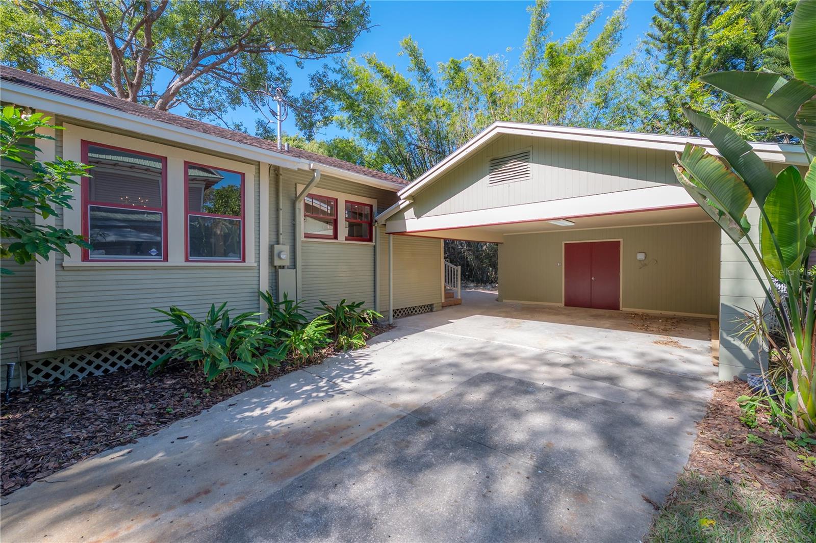 Detached carport with an enclosed storage room