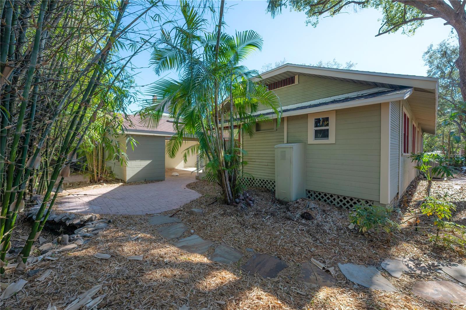 The spacious, shaded backyard provides a versatile canvas for your vision