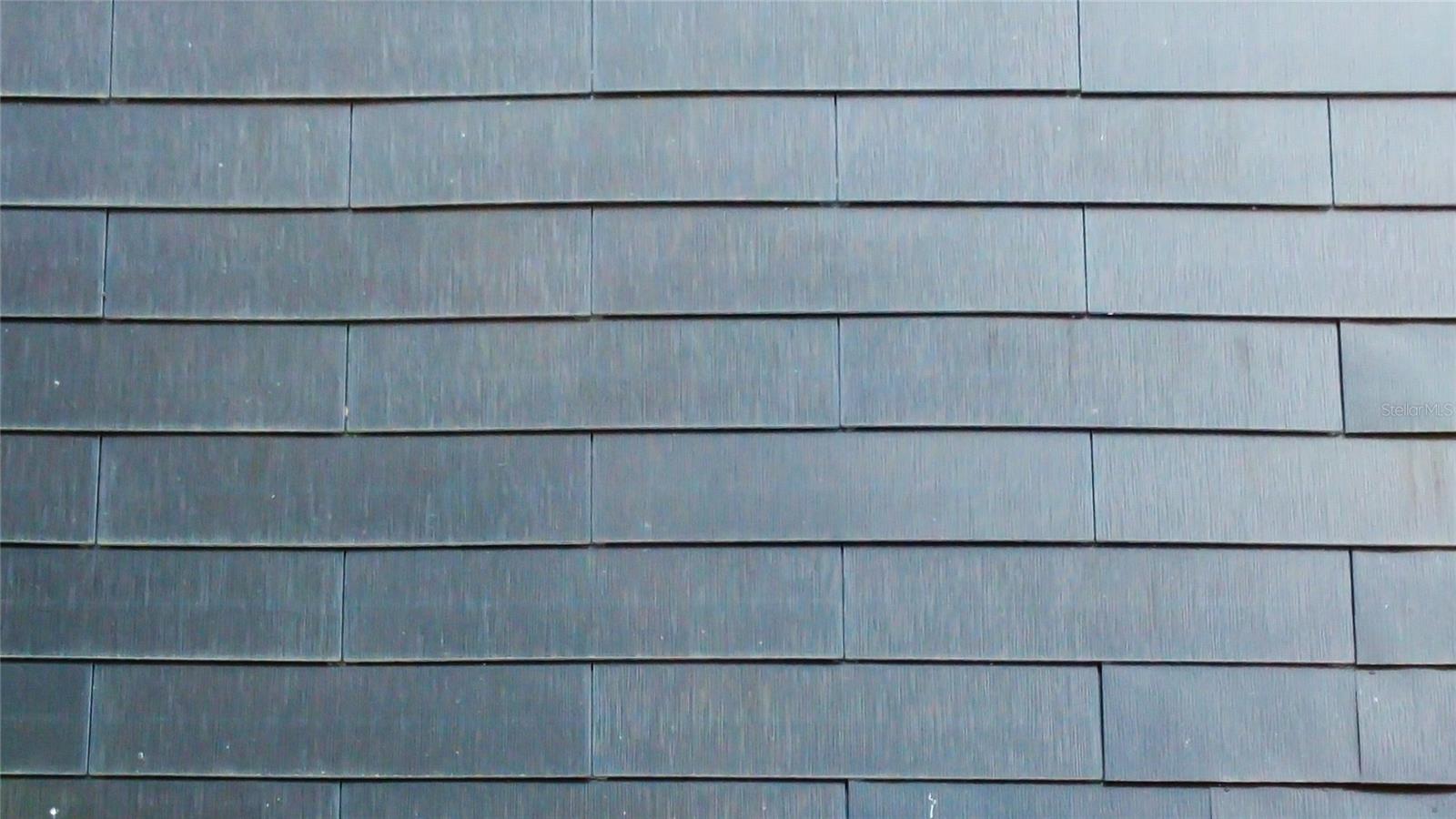 Up close picture of the New Tesla Solar Roof. This Solar is Owned.