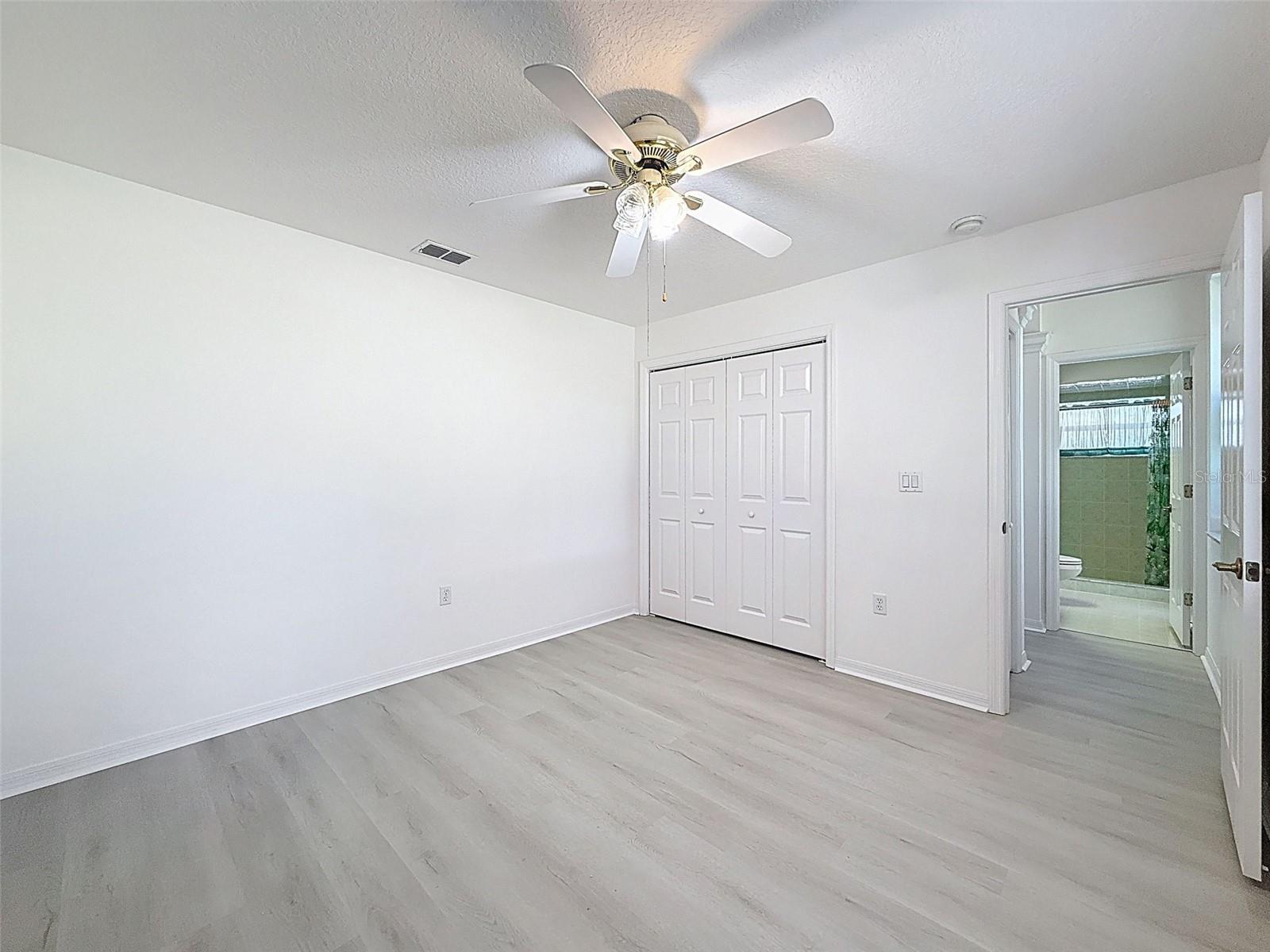 Guest suite bedroom with close by pool bathroom