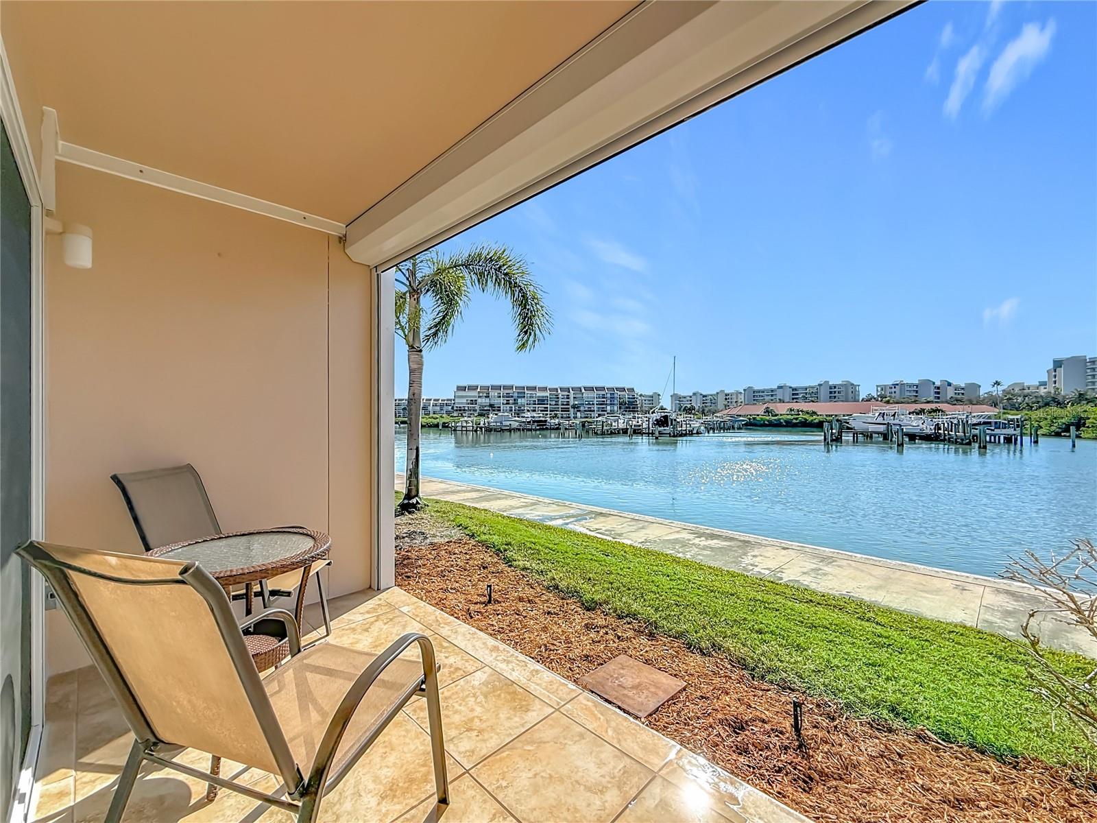Welcome to Paradise!  This is your private patio that overlooks the water.  Picture yourself relaxing and enjoying the tranquility that this condo offers or visitng friends.  There is a 1.5 walking trail around the entire community for exercise and fun that is pictured here.
