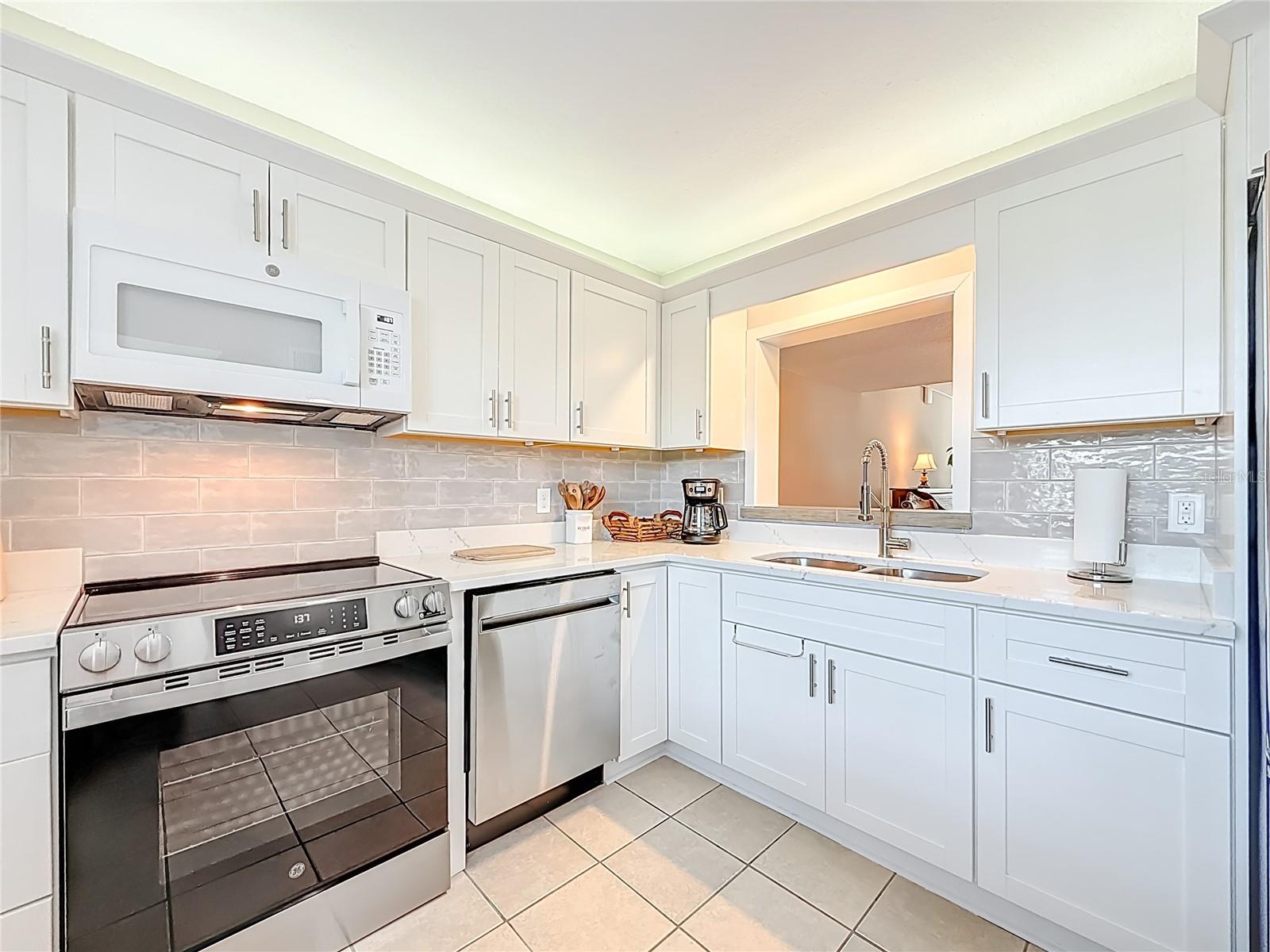 The bright, contemporary design offers plenty of workspace & storage.