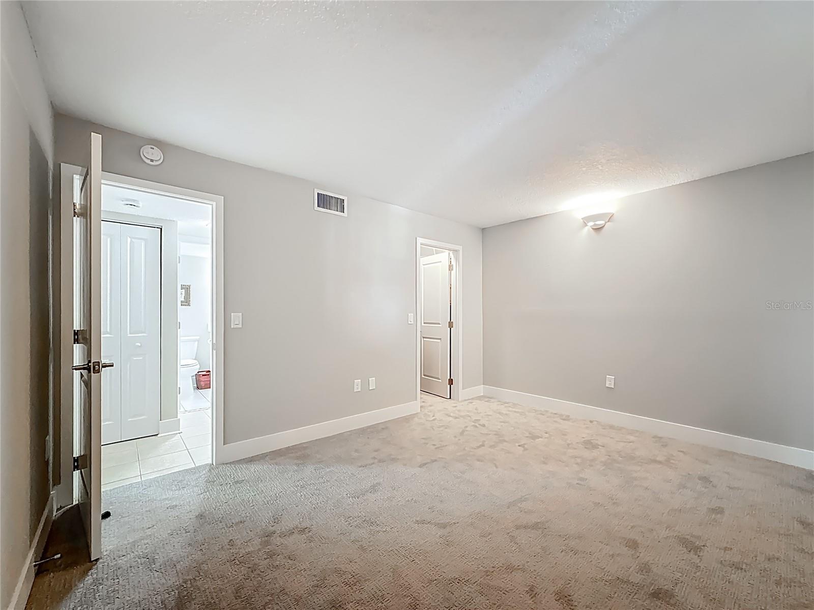 The guest bedroom is right across from the guest bathroom for added convenience.