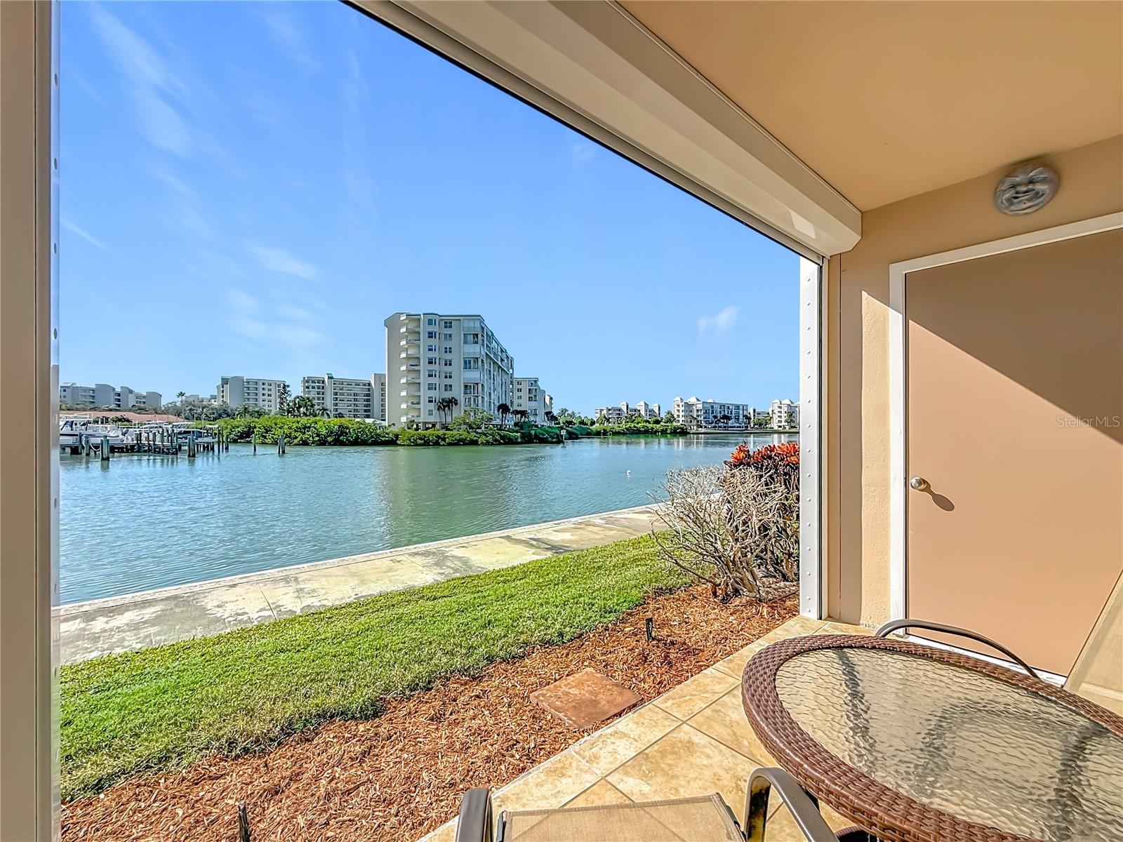 This is your private patio overlooking the water.  To the right is a nice sized storage closet.  Notice the hurricane shutter at the top.  This makes it easy to just lower your hurricane shutter and not have to move your pario furniture inside.