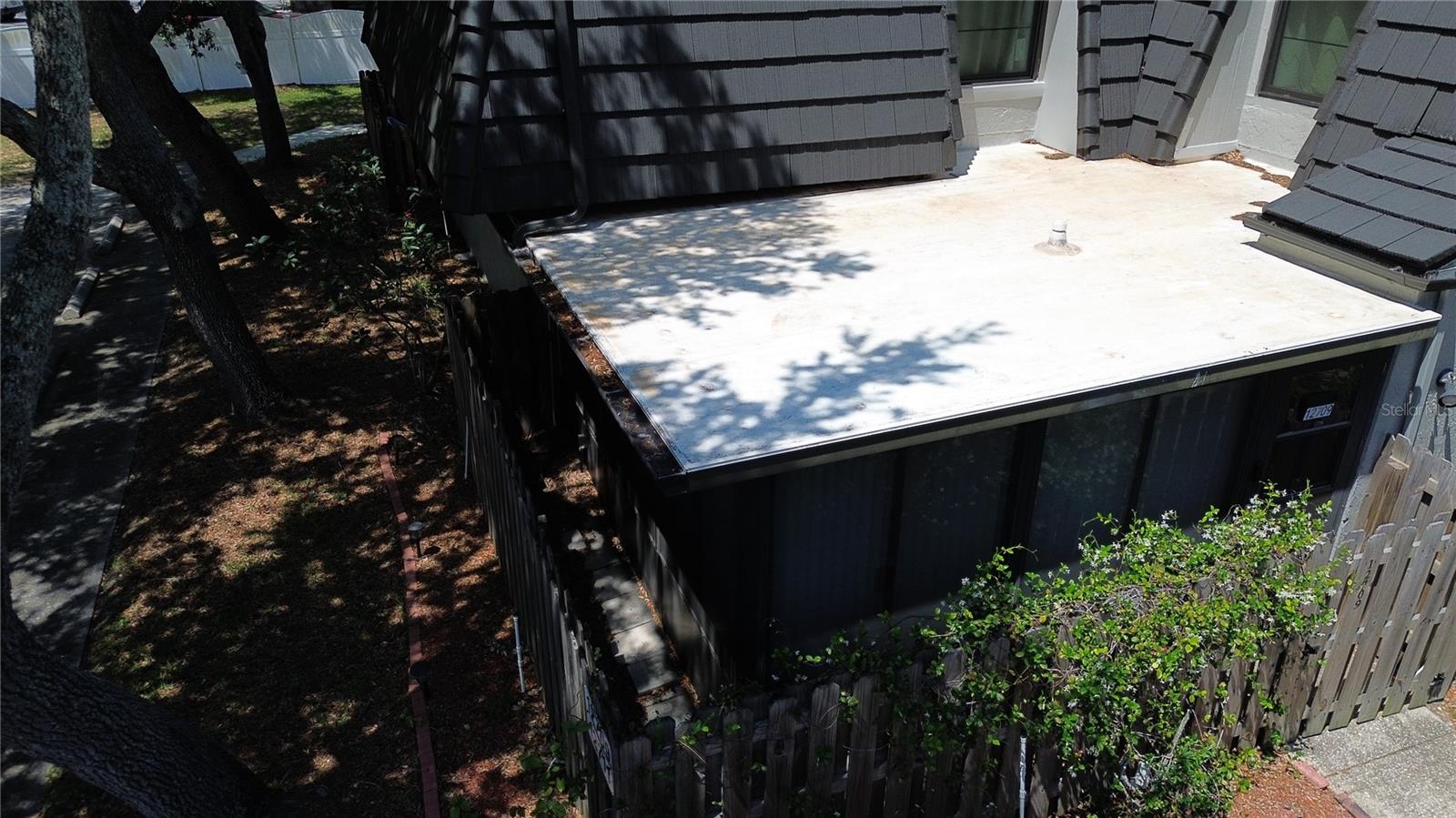 Drone view of Sunroom Roof- freshly sealed and painted