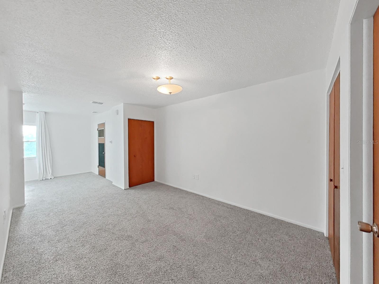 The large bedroom has also been tastefully updated with new carpet and fresh paint