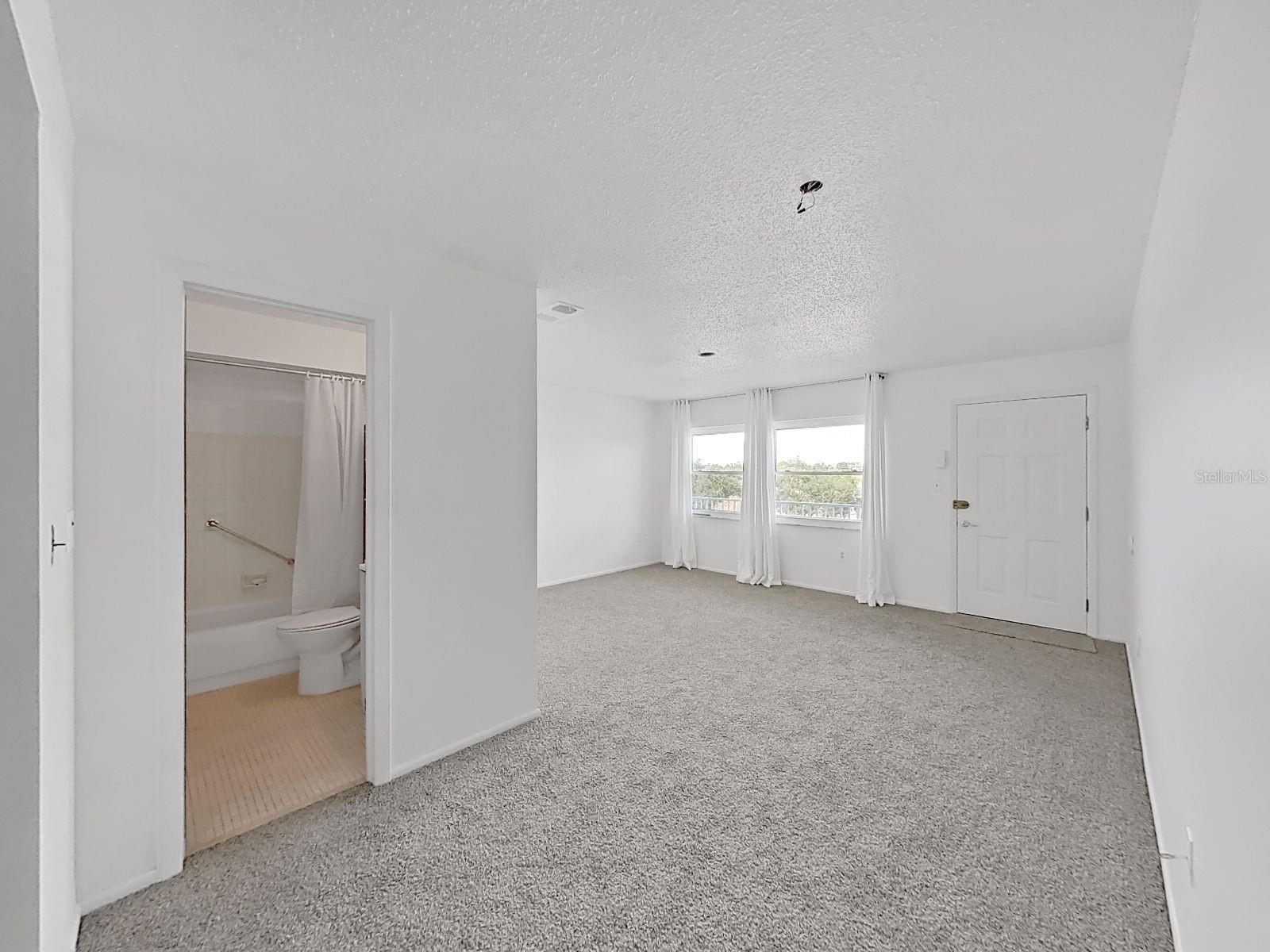 Full bathroom off hallway and Living room!