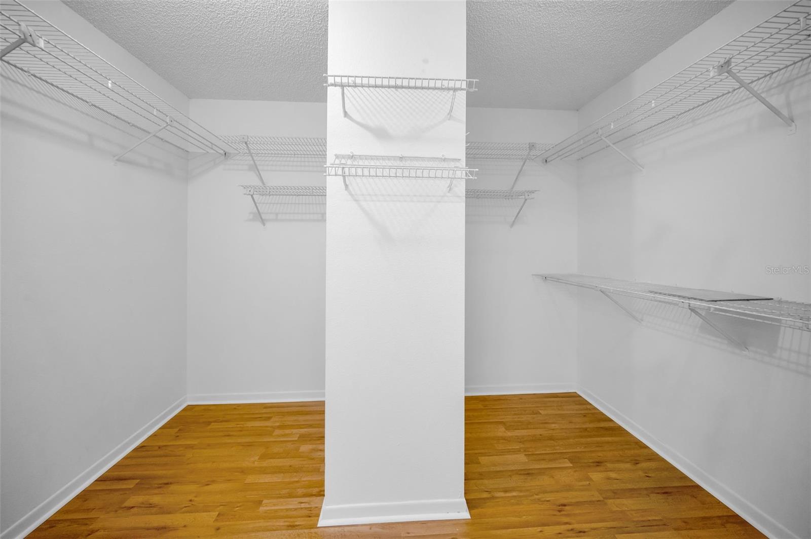 Primary bedroom walk in closet.