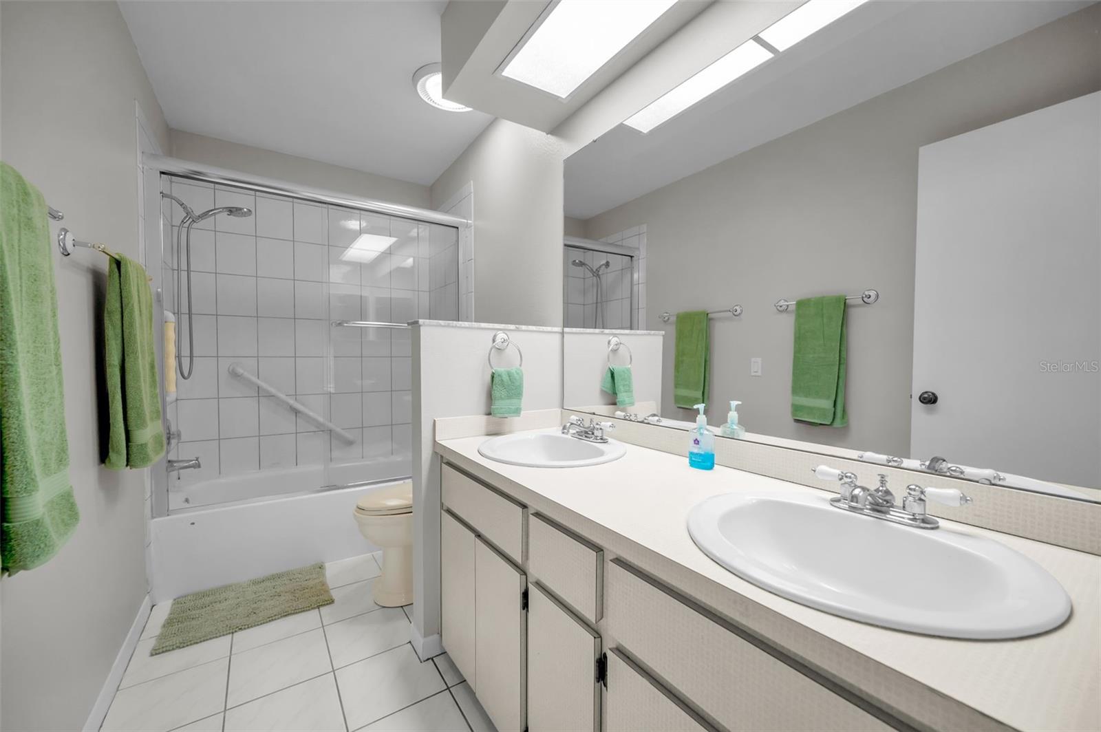 Second bathroom, double vanity, tub/shower.