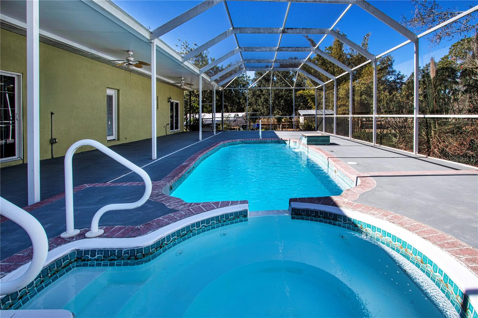 Expansive screened in enclosed pool and spa