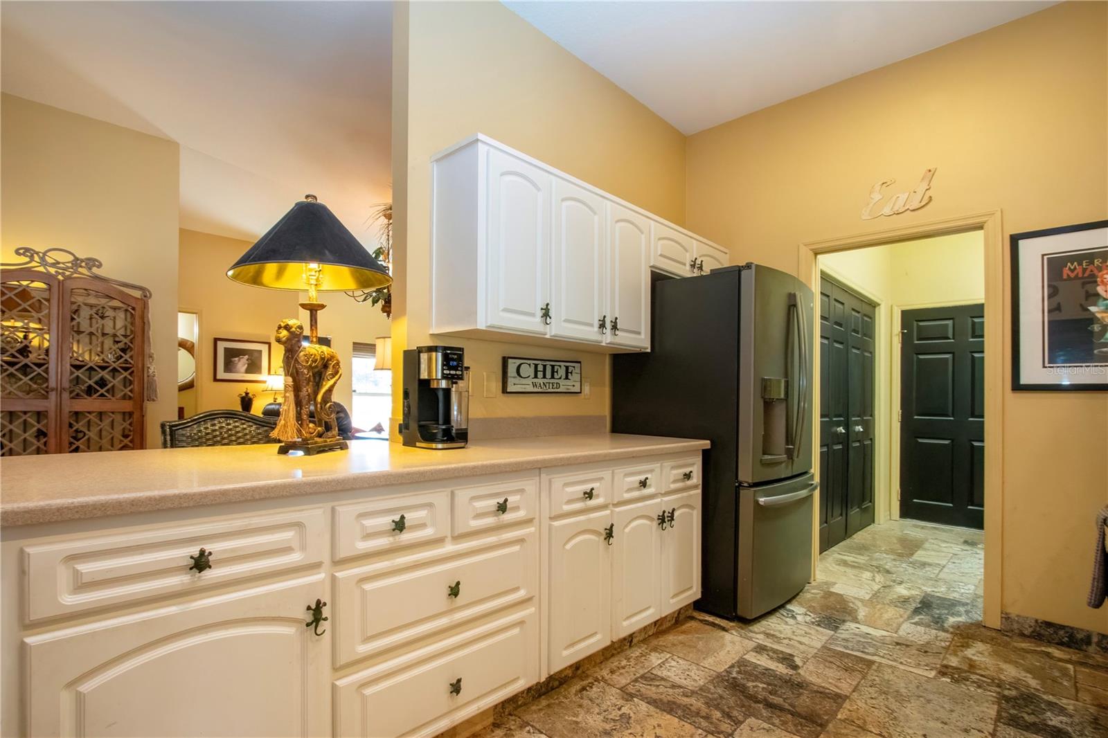 other side of the kitchen with more cabinets and counter space