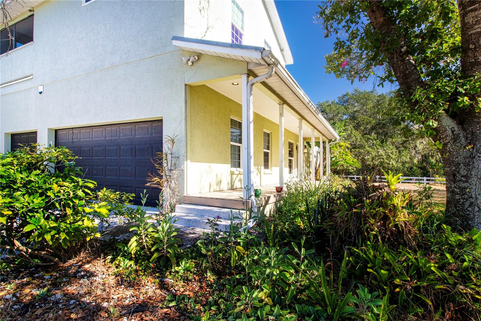 side view of home and a 3 car garage