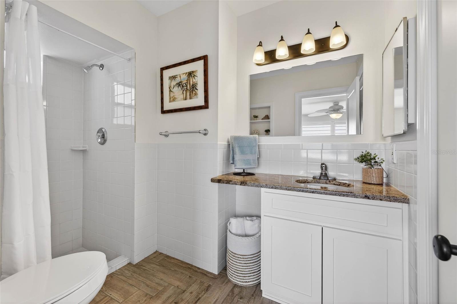 En-suite bathroom with walk-in shower and plenty of storage