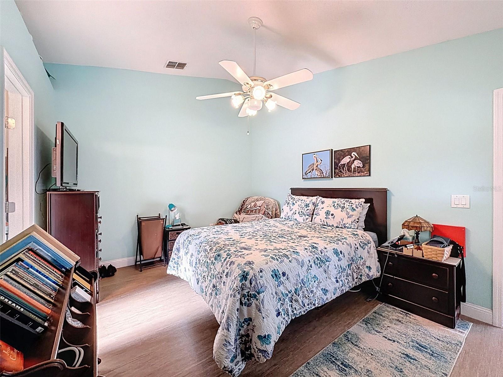 Primary Bedroom features a door to the pool & pool lanai