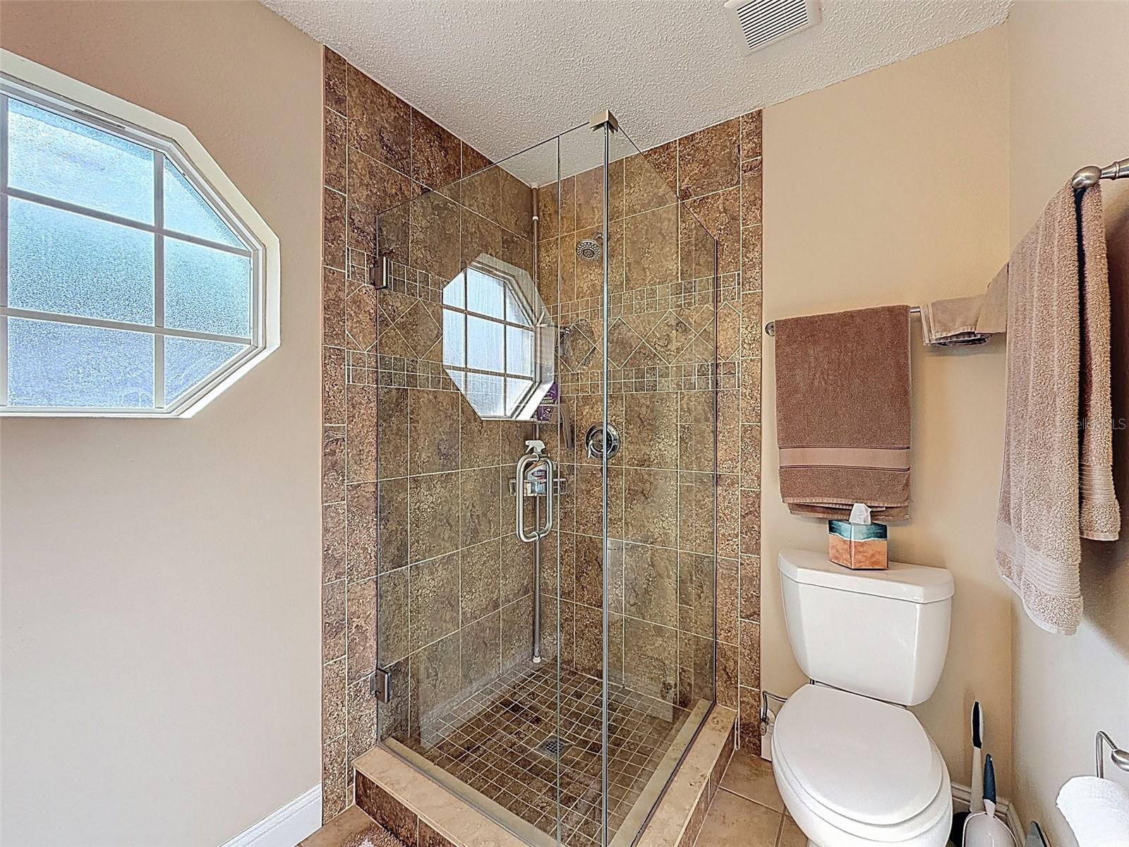 Updated glass enclosure in the Primary Bath