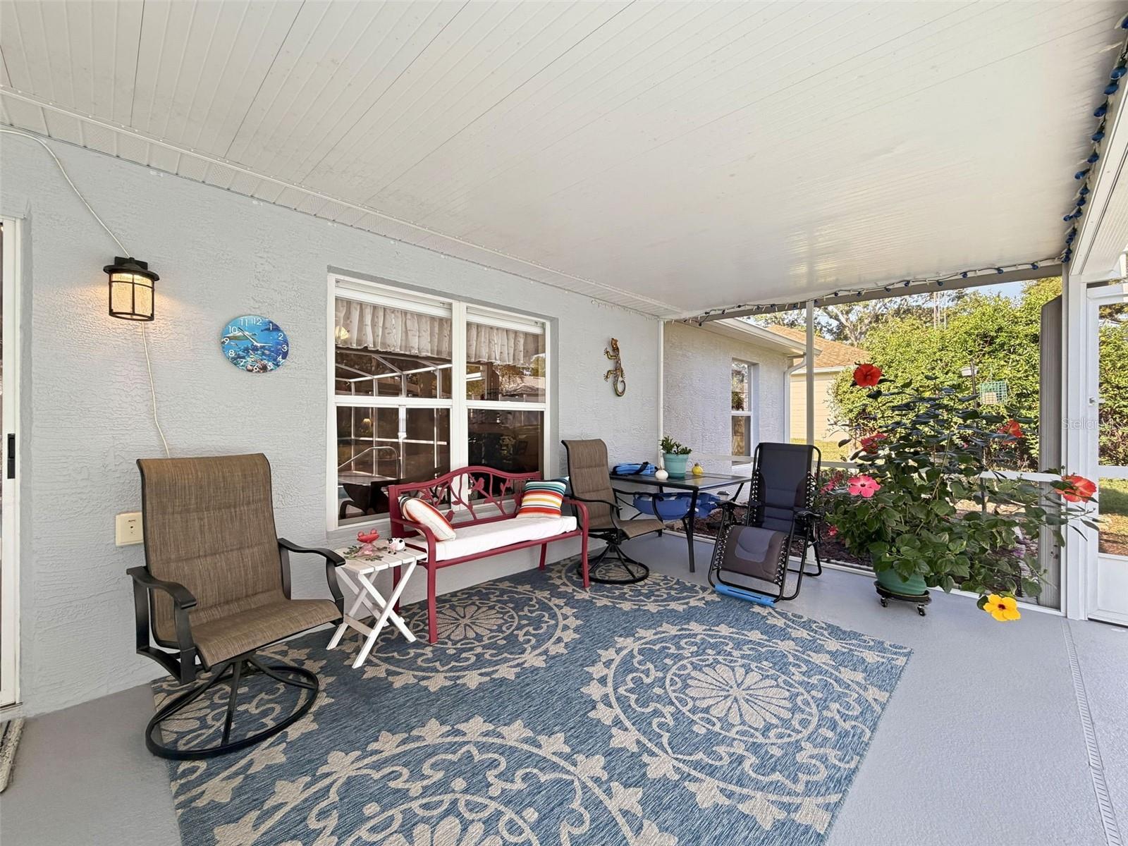 Look at that gorgeous hibiscus!  Your plants will love this lanai!