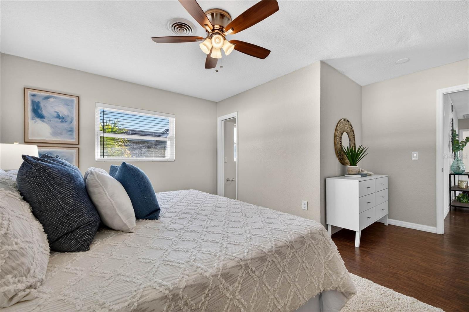 Primary bedroom filled with natural light and comfort