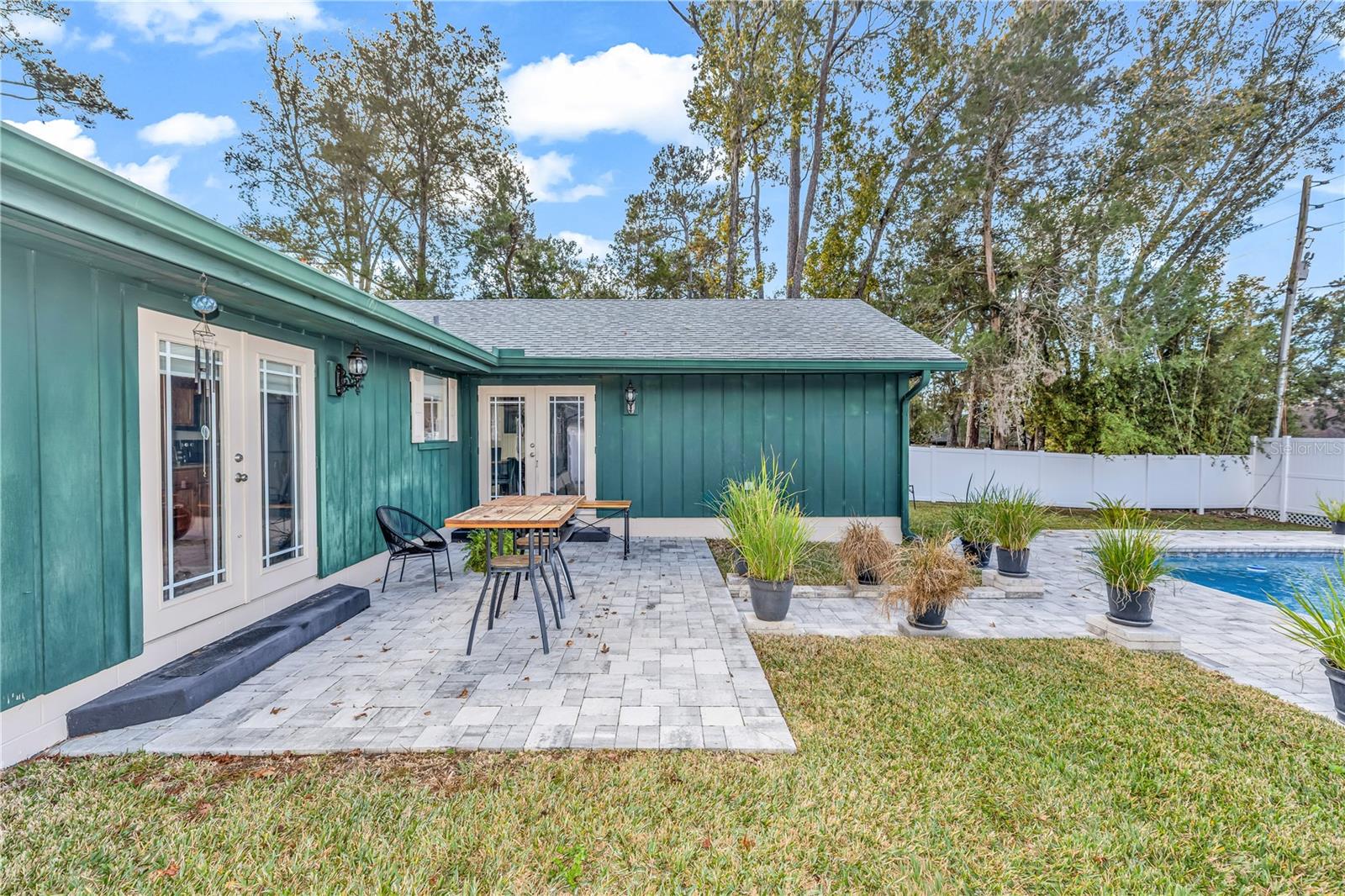 Newly paved back patio/pool deck