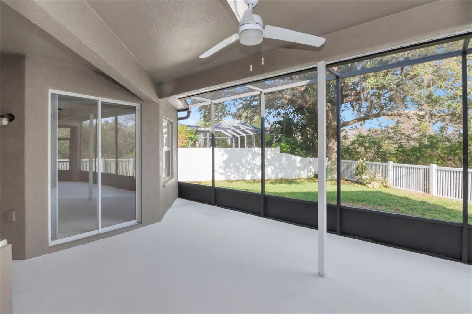 Screened Covered Lanai to Fenced Yard.