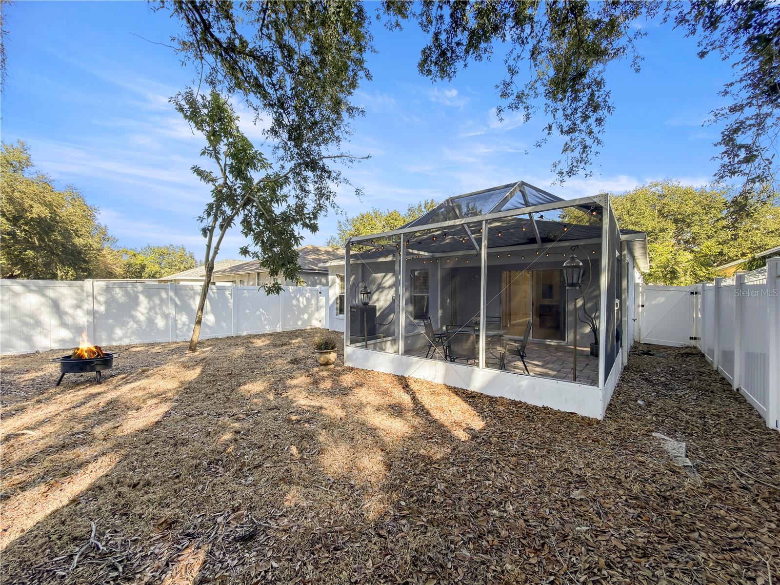 Back yard is fully fenced with vinyl fencing and access on both sides