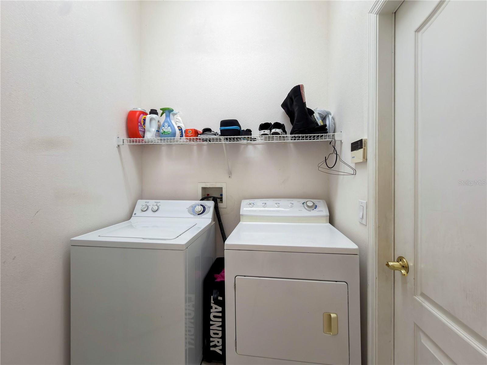 Laundry room with door to garage
