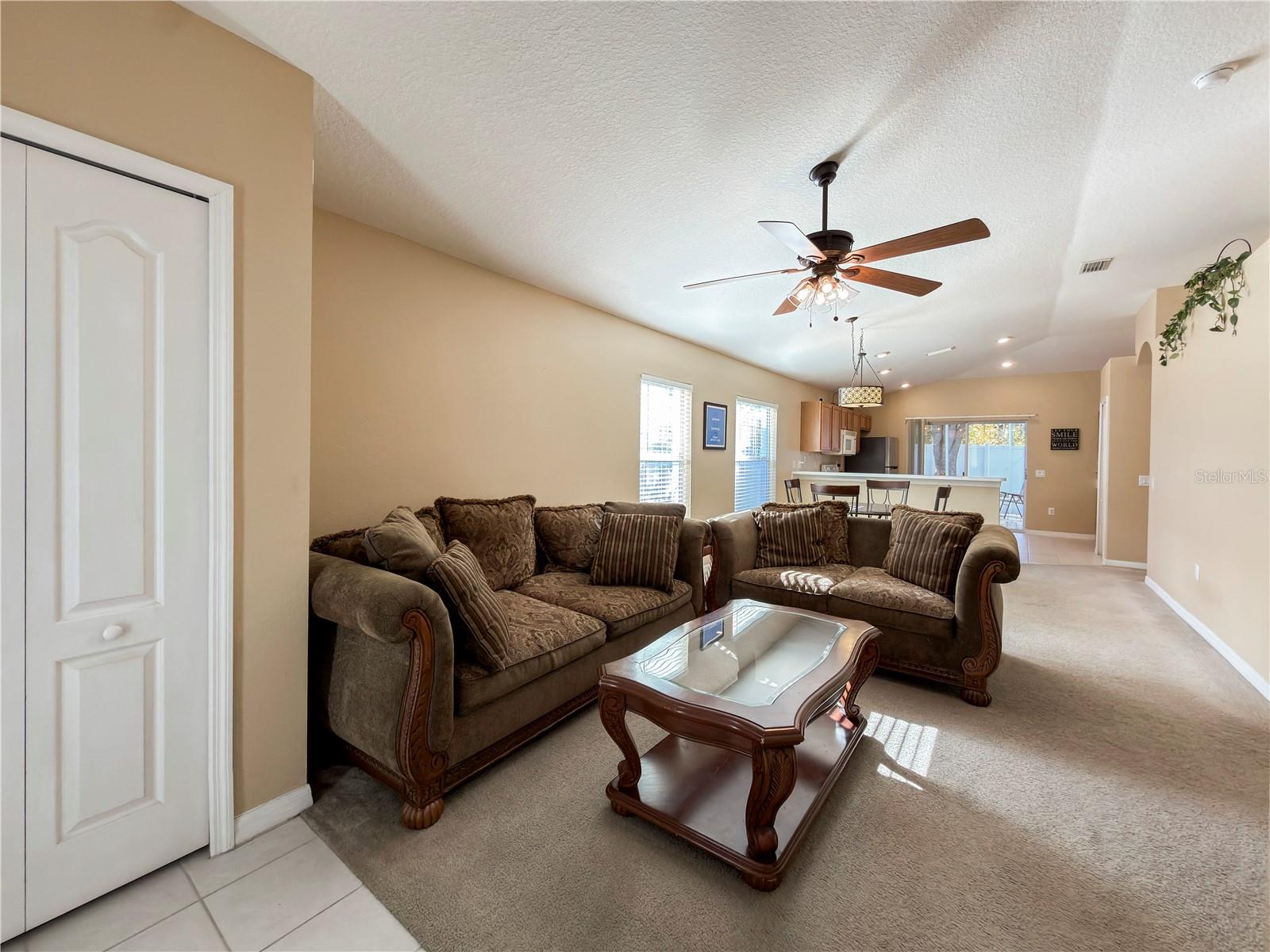 Front entrance with vaulted ceilings and plenty of natural light
