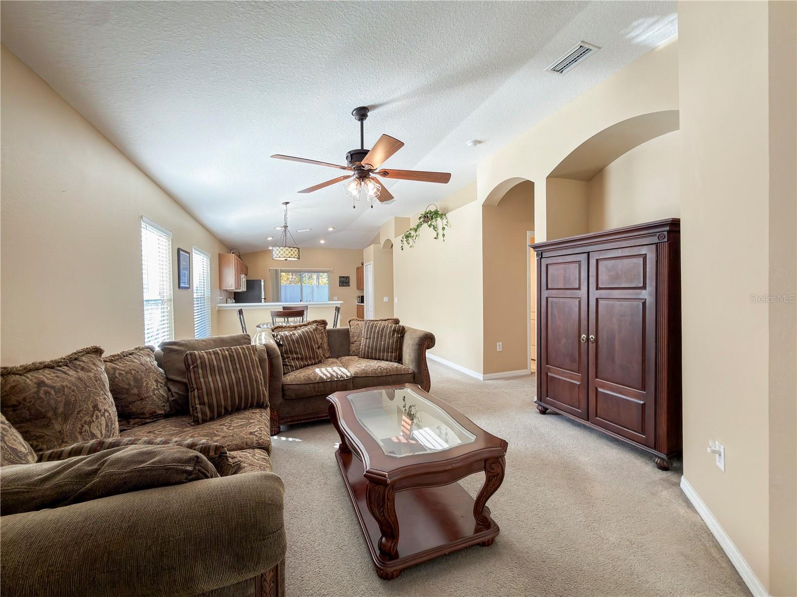 Designer archways, recessed lightning and open floor plan