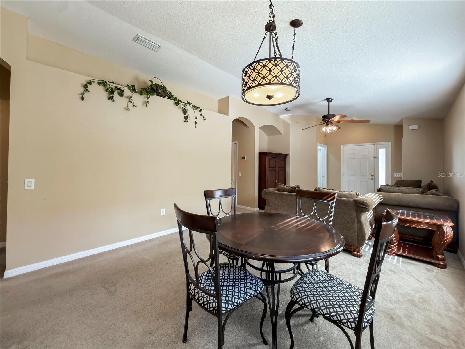 Open floor plan dining flows into living area