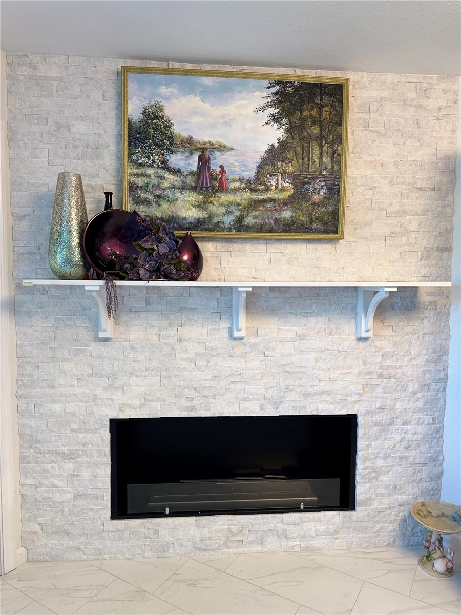 Elegant fireplace enhances the coastal ambiance, perfectly complementing the serene ocean views.