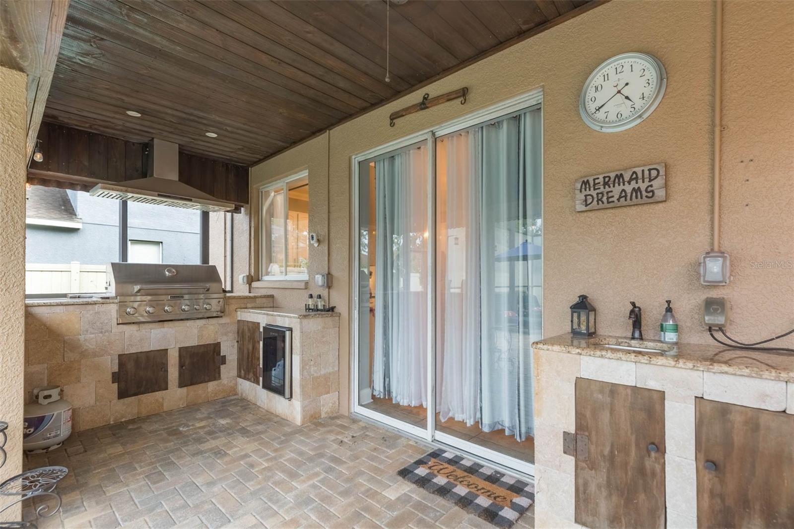 Summer kitchen with updraft, refrigerator, additional storage and sink