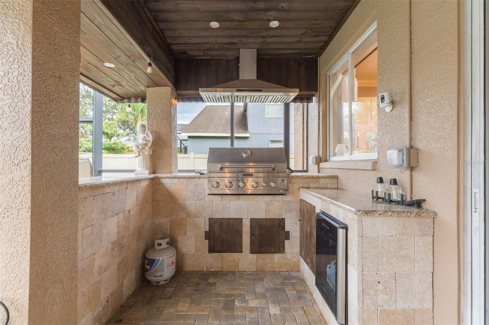 The grill master's domain with area for barstools outside.  Perfect party place!