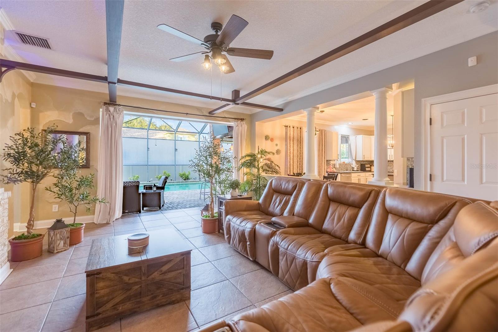 Triple sliders open fully, bringing in the outdoors