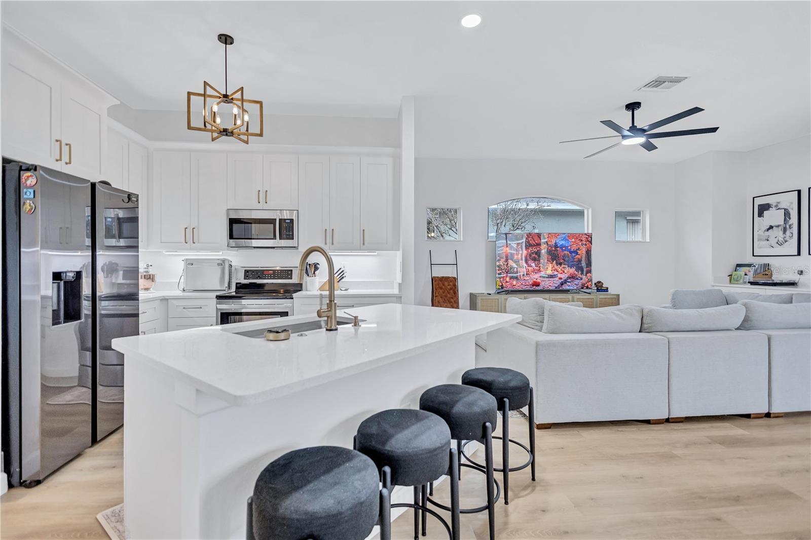 Open Kitchen floor plan with Island Bar Seating for four as well as large Eat In Kitchen Space overlooking Family Room