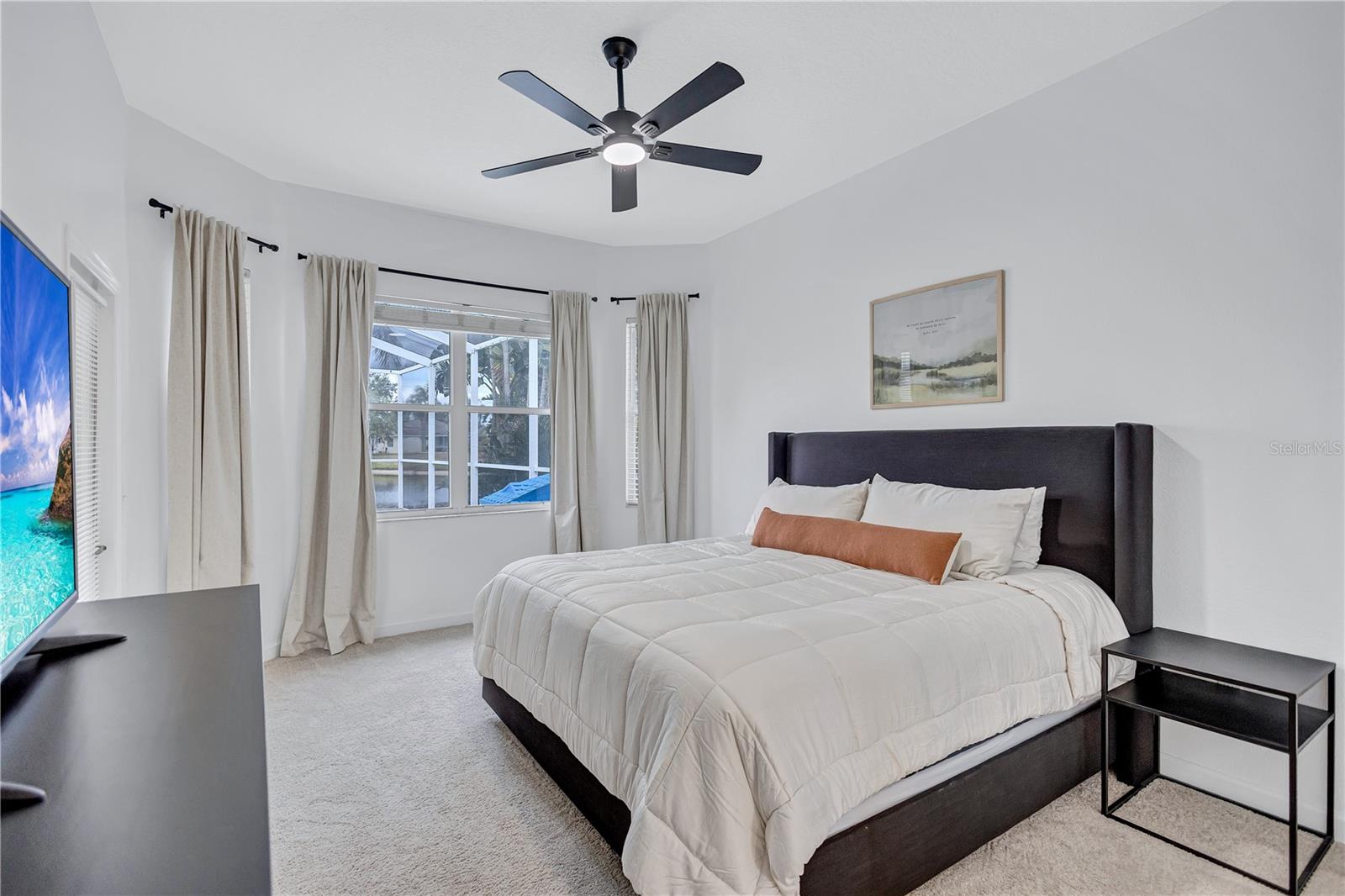 Spacious Primary Bedroom overlooking Pool Deck & Pond