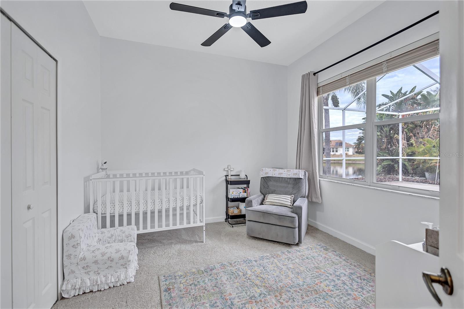 4th bedroom with window overlooking Pond and Pool Deck