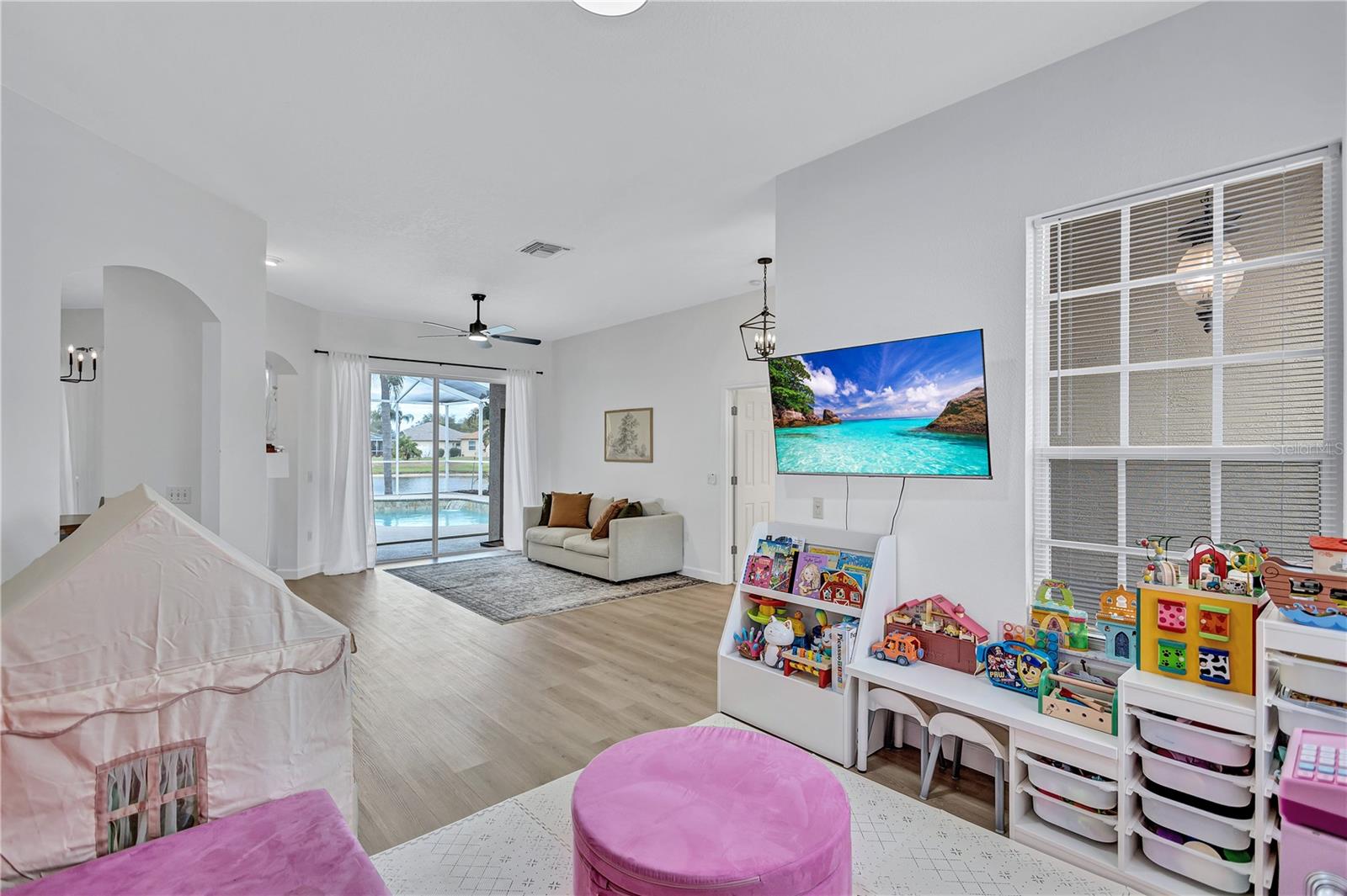 Formal living room view from Dining Room is currently utilized as a play area for the young ones.