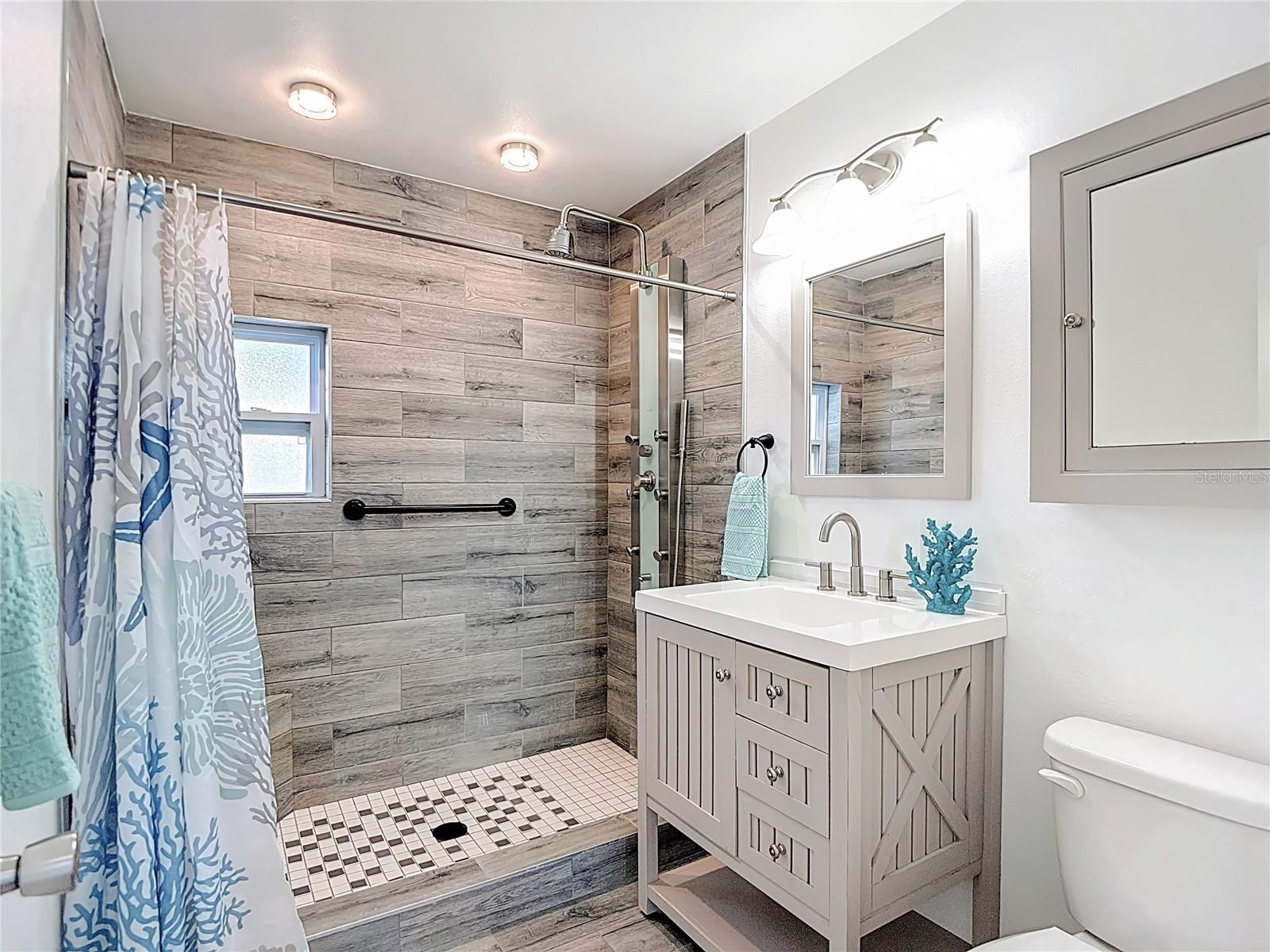 Fully updated bath w/ walk in tiled spa shower