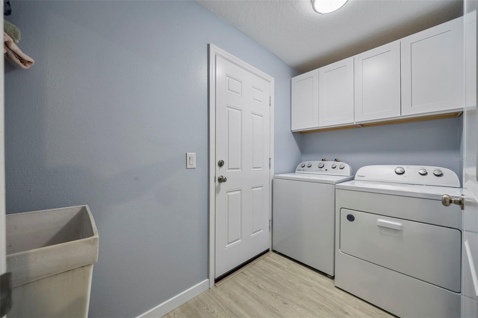 Inside laundry room with wash tub