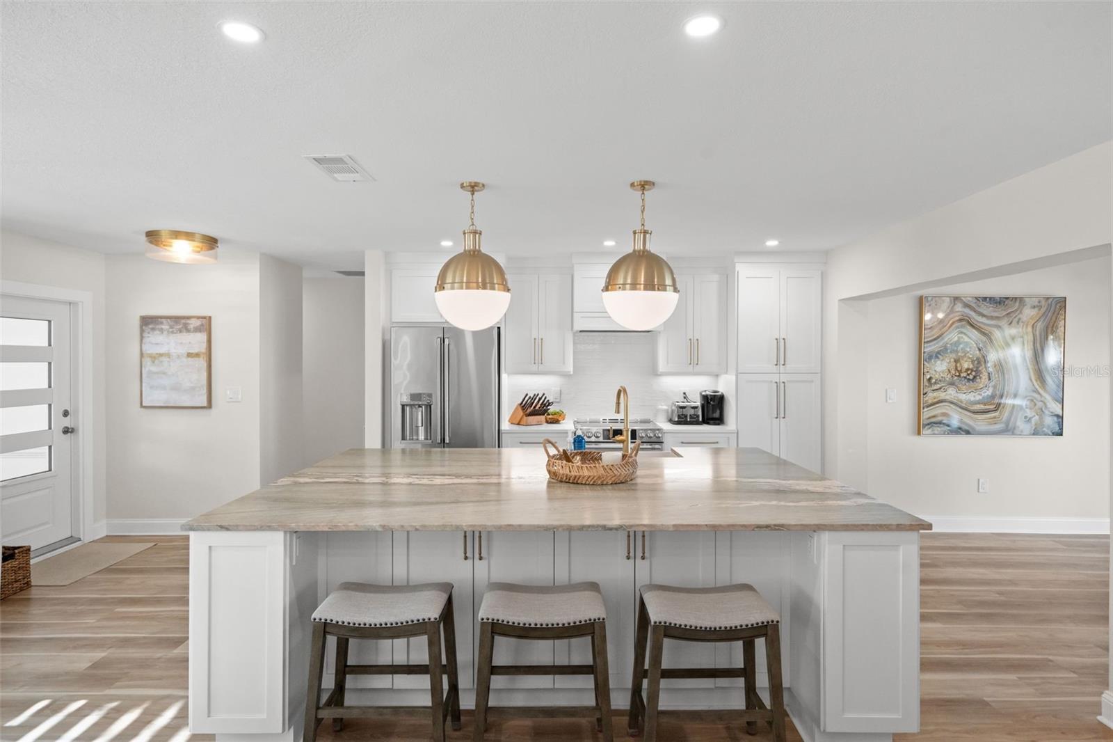 Chef’s kitchen with high-end appliances and custom cabinetry.