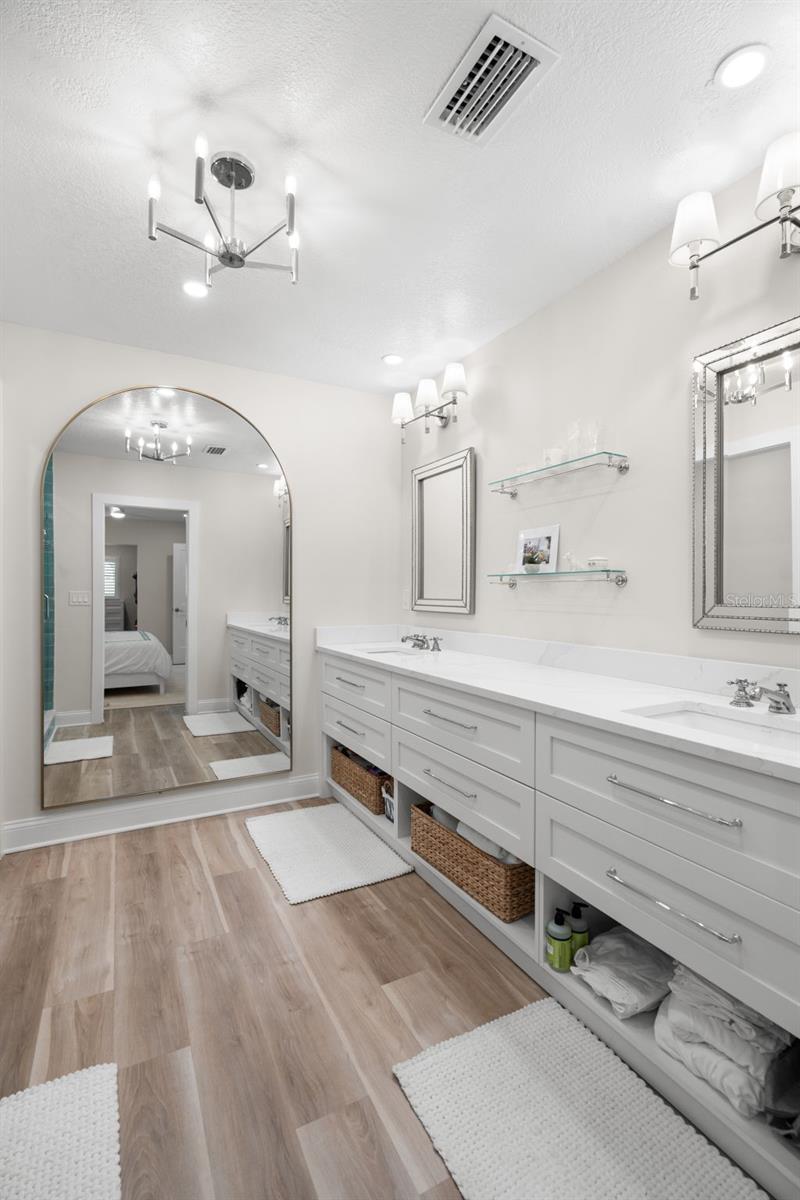 Updated bathroom with quartz vanity and modern finishes.
