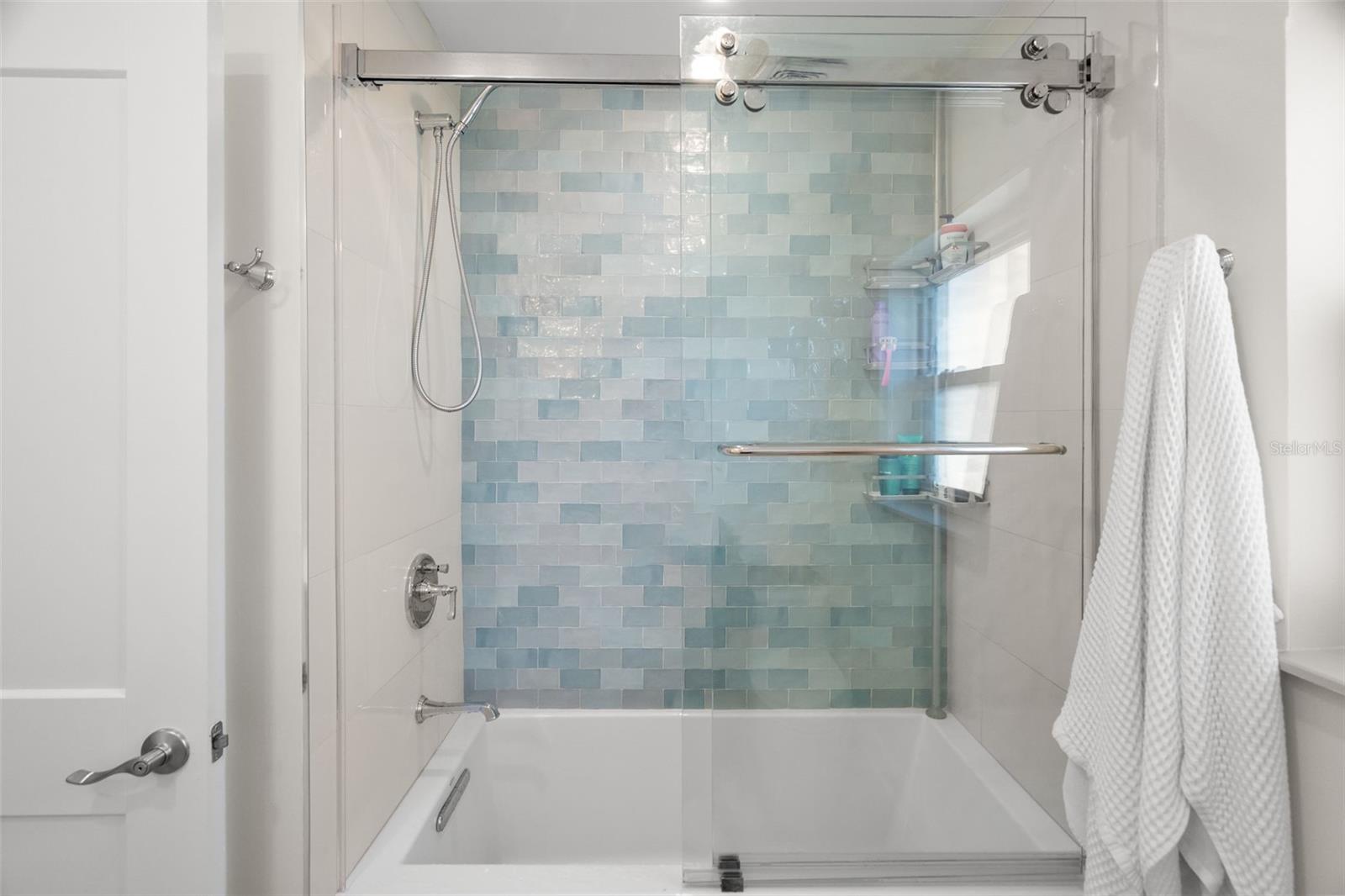 Clean and bright guest bathroom with updated fixtures.