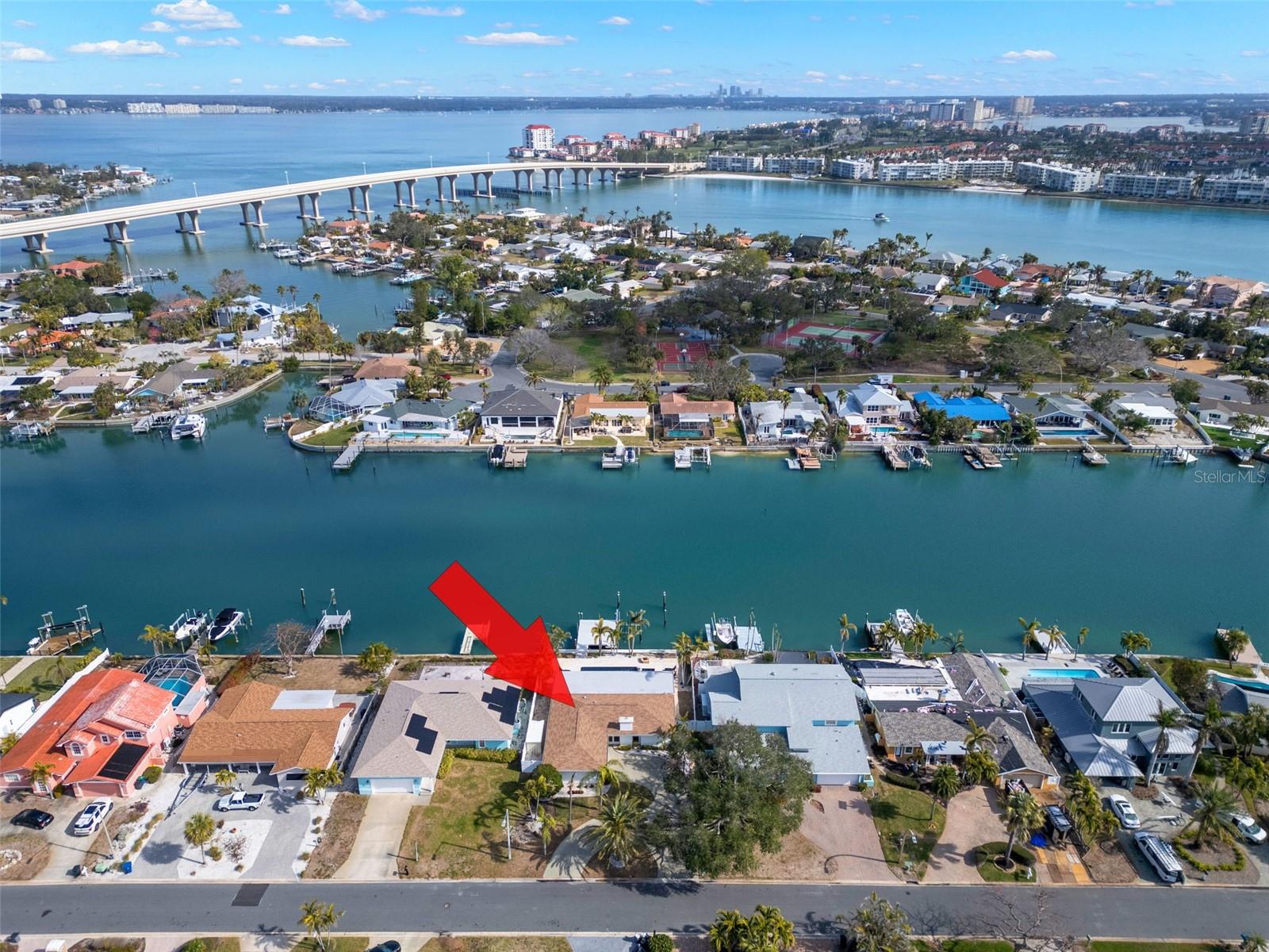 Aerial view highlighting the property’s waterfront position.