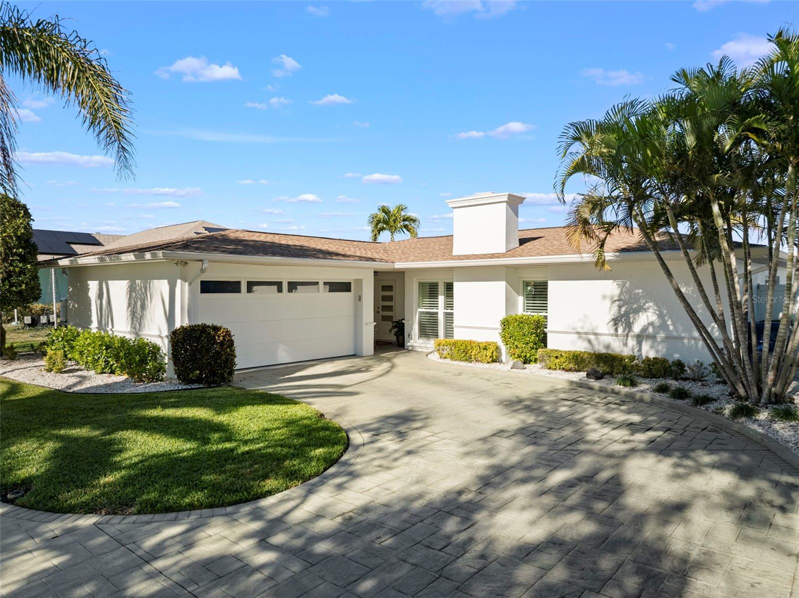 mpact-rated front door and garage, enhanced with clean modern exterior lines.